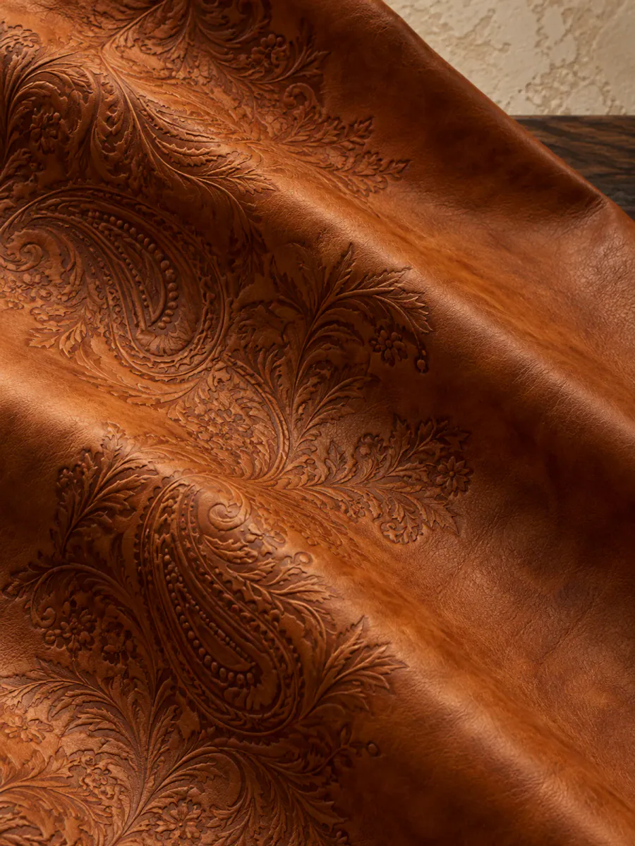 Tooled Cognac leather finish in an editorial material study